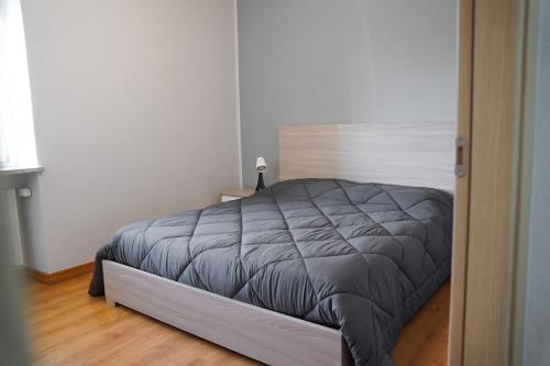 a bedroom with a large bed in a room at B&B dolcenotte in Gattico