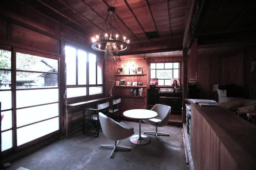 a dining room with a table and chairs and a chandelier at Maroya - Vacation STAY 16538 in Hamamatsu