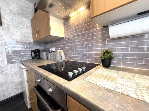 a kitchen with a sink and a counter top at Bayside in Bridlington
