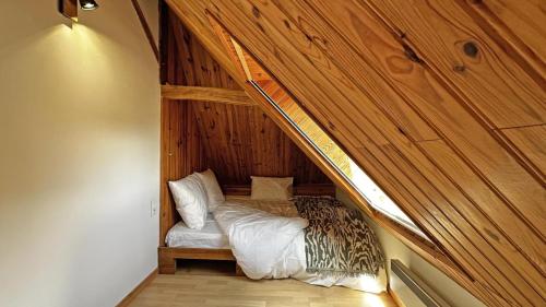 Llit o llits en una habitació de La petite maison
