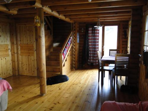 a dining room with a table and chairs in a cabin at Katafygio Chalet, Krikello in Kríkellon