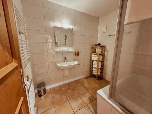 a bathroom with a sink and a mirror at Alpinresort Kaprun 3 in Kaprun