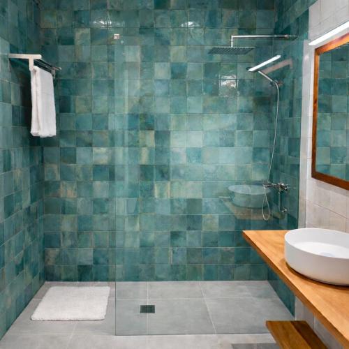 a bathroom with a sink and a shower at Azahara Beach in Arona