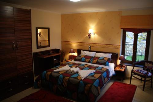 a bedroom with a bed with a teddy bear on it at Patriko in Áyios Nikólaos