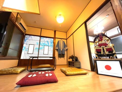 a room with a room with a bed and a window at New SAMURAI House in Tokyo