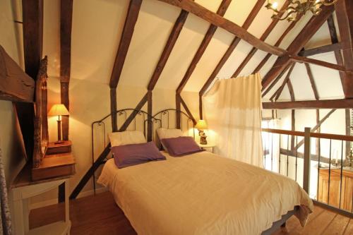 Llit o llits en una habitació de Le moulin