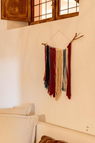a bunch of threads hanging on a wall at Finca Can Rosa Ibiza, private pool, a nature getaway in Santa Gertrudis de Fruitera