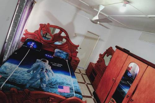 a bedroom with an astronaut toy on a bed at Inviting 1-Bed House in Brusubi in Brusubi