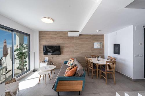 a living room with a couch and a table at Terrazas de Ladera Duplex 7 Casasol in Nerja