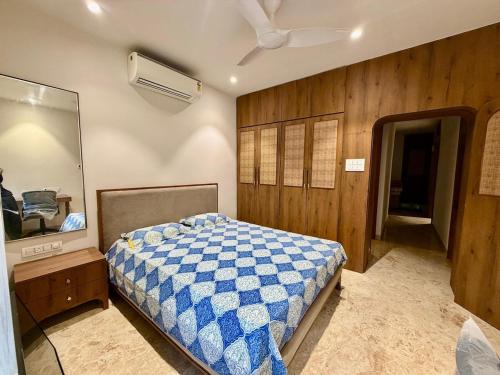 a bedroom with a bed and a mirror at Shobhalay- Premium 2BHK Parking prime location super interior in Rānchī