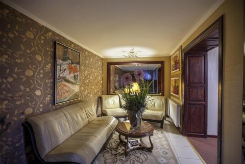 a living room with a couch and a table at Kormoran Medispa in Rowy