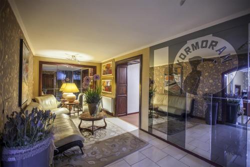 a living room with a couch and a table at Kormoran Medispa in Rowy