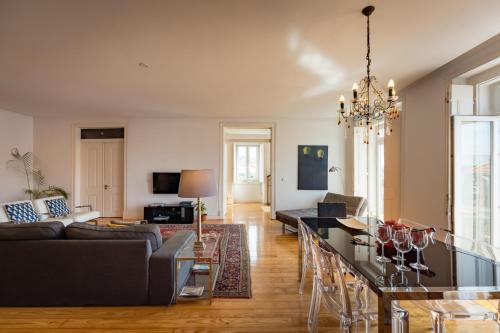 a living room with a couch and a table at Eighteen21 Houses - Casa de São Paulo in Lisbon