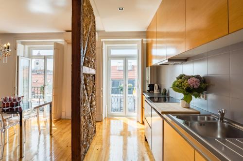 a kitchen with a sink and a counter top at Eighteen21 Houses - Casa de São Paulo in Lisbon