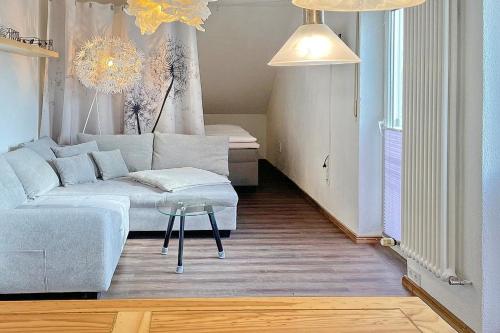 a living room with a couch and a table at Pusteblume in Lübbenau