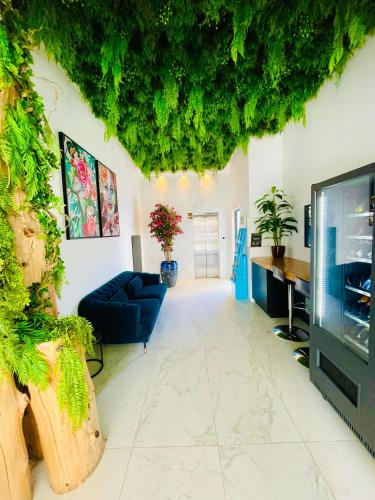 a living room with a couch and a tv at Sveltos Residence Suites in Larnaca