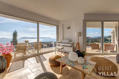 a living room with a view of the ocean at Villa Karima with Sea View in Metókhion