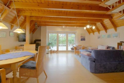 a living room with a couch and a table at SV2 Opi-Huck-Stroot 37 in Dorum-Neufeld
