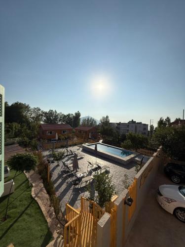 a swimming pool in the middle of a yard at Beit Mirna Guesthouse & Chalet - Ehden in Ehden
