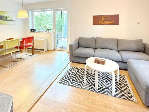 a living room with a couch and a table at Kiefernwäldchen in Byhlen