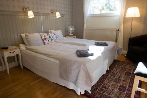 Letto o letti in una camera di Lilla Hotellet i Nora
