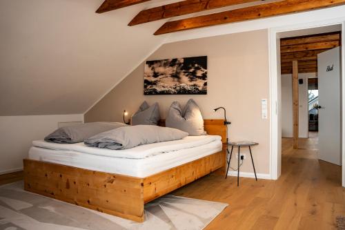 a bedroom with a wooden bed in a room at Alb Appartement - gemütliche Wohnung mit Balkon in Balingen
