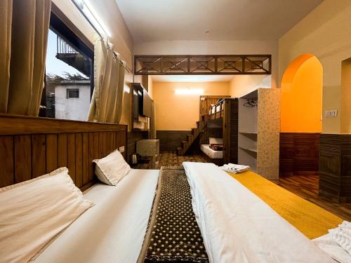 a bedroom with a large bed in a room at Vacation home in Dharmsāla