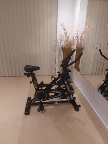 a bike parked in a room next to a wall at HARF22G02-02 stylish 2BR in AD in Abu Dhabi