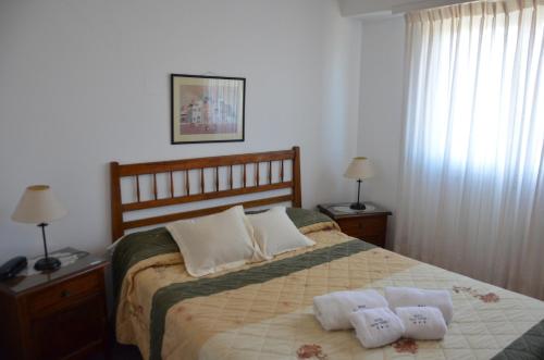 En eller flere senge i et værelse på Hotel Santa Eulalia I