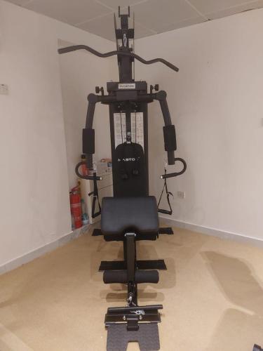 a black office chair sitting in a room at HARF22-01 comfy 1BR Apt in Abu Dhabi City in Abu Dhabi