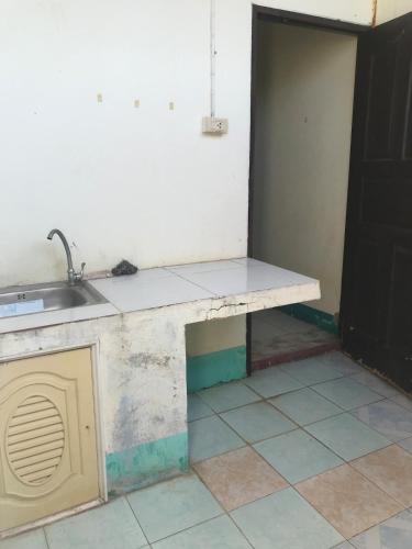 a kitchen with a sink and a counter top at Yada House in Nong Ki