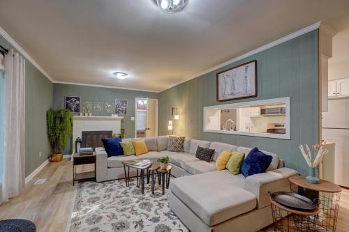 a living room with a couch and a table at Downtown Guest House in Raleigh
