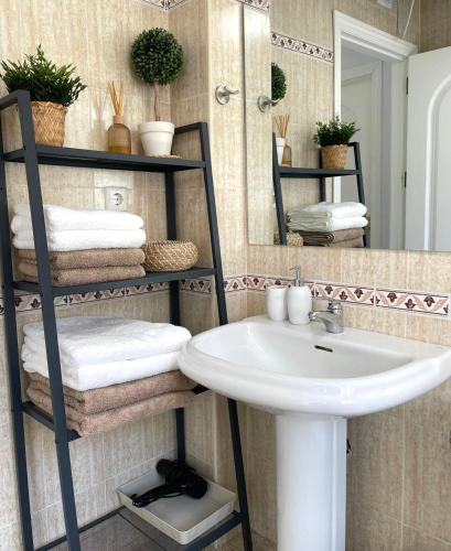 a bathroom with a sink and a mirror at Beach Side Heaven in Fuengirola