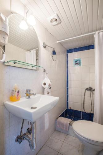 a bathroom with a sink and a toilet at Evdokia Old Town Hotel in Rhodes Town