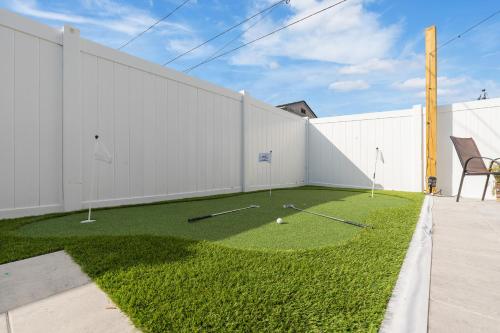 a yard with some golf balls on the grass at Luxury Vacation Home in Madeira Beach Family and Pet Friendly in Seminole