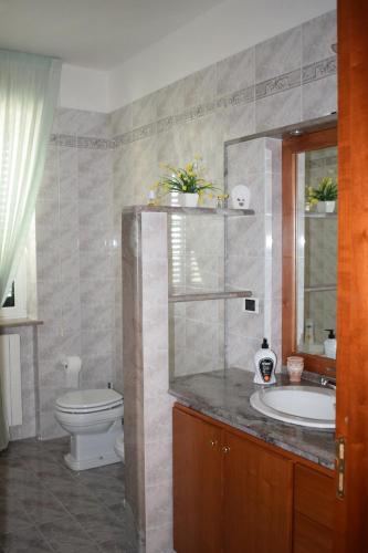 a bathroom with a sink and a toilet at Valle holiday locazione turistica in Locorotondo