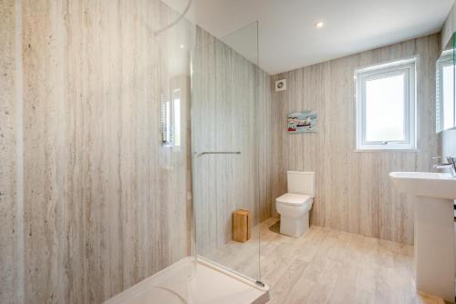 a bathroom with a shower and a toilet and a sink at 2 Bed in St. Issey oc-o27778 in Saint Issey