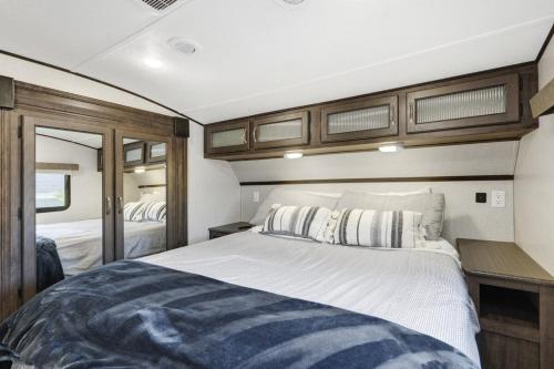 a bedroom in a motor yacht with a large bed at Roam sweet roam in Ellenton