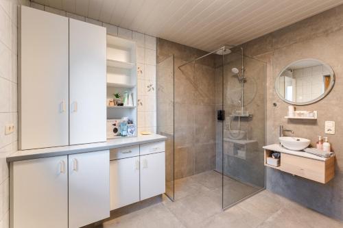 a bathroom with a shower and a sink at Mountain Apex in Dölsach