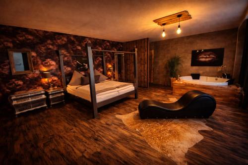 a bedroom with a bed and a tub in it at Time Out 3 in Vreden