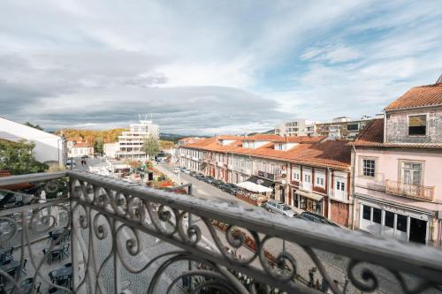 a view of a city from a balcony at Santo Thyrso Villas in Santo Tirso