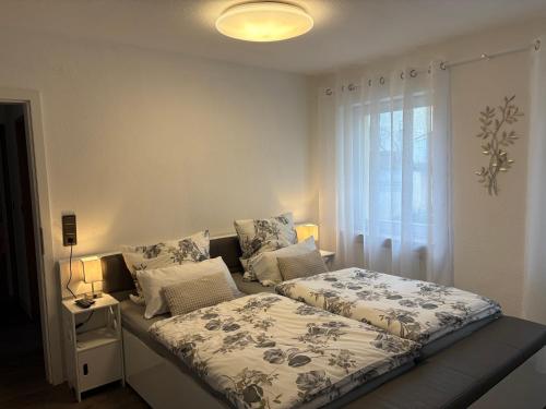 a bedroom with a bed and a window at Ferienwohnung Melanie 300 Meter zur Therme in Bad Ems