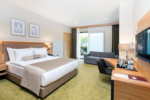 Ένα ή περισσότερα κρεβάτια σε δωμάτιο στο Mia City Hotel