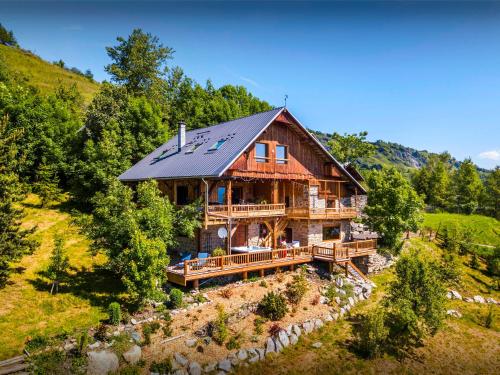 an overhead view of a log house on a hill at Chalet Bendo - OVO Network in Villarembert
