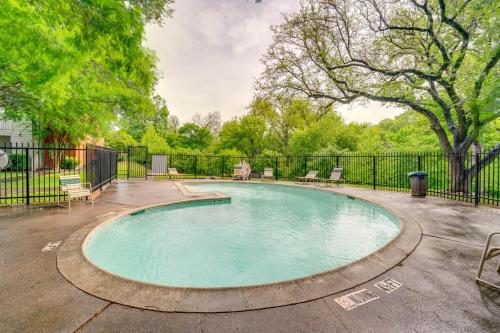 a swimming pool in a yard with a fence at 1 Bedroom apt w Swimming Pool Wifi Parking In Dallas TX in Dallas