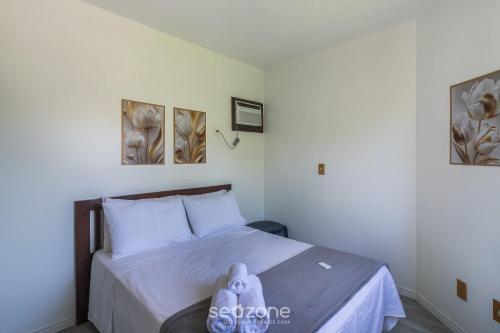 a bedroom with a bed with a stuffed animal on it at 1-Bedroom Apt in Blumenau SPN0102 in Blumenau