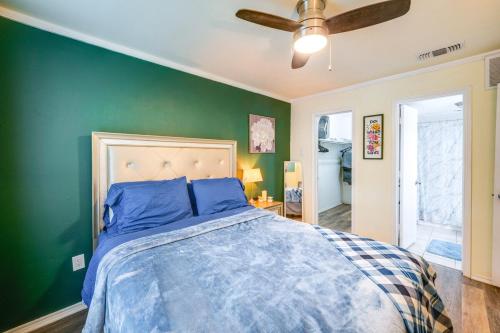 a bedroom with a bed with a green wall at 1 Bedroom apt w Swimming Pool Wifi Parking In Dallas TX in Dallas