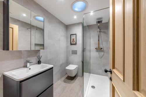 a bathroom with a toilet and a sink and a shower at 2 Bed in Norham oc-p34181 in Norham