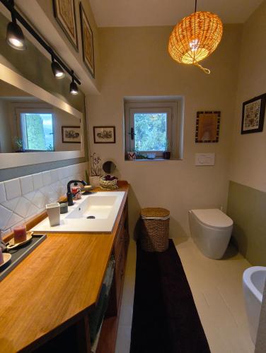a bathroom with a sink and a toilet at La Campana in Impruneta