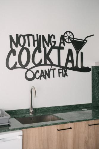 a sign for a restaurant on a kitchen wall at A Praia, My Own Paradise- Estúdio in Figueira da Foz